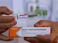 החיסון לקורונה של חברת סינבאק הסינית / צילום: Eraldo Peres, AP