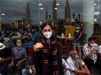 מפגינה פרו-דמוקרטית לבושה כדמות מהארי פוטר במחאה בתאילנד  / צילום: Athit Perawongmetha, רויטרס