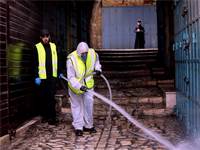 פעולות חיטוי נגד נגיף הקורונה בעיר העתיקה של ירושלים / צילום: Mahmoud Illean, AP