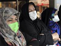 אזרחות איראניות לובשות מסכות מגן / צילום: Ebrahim Noroozi, AP