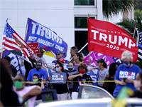 תומכי טראמפ ותומכי ביידן בעצרת בחירות בפלורידה / צילום: Wilfredo Lee, AP