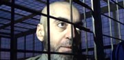 שבויים תומכי אסד, עלווים כלואים בכלובים של דאע"ש / צילום: וידאו