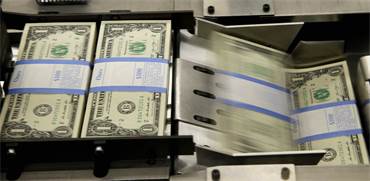הדפסת דולרים בוושינגטון / צילום: REUTERS/Gary Cameron