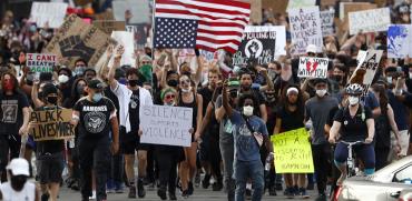 מתוך ההפגנה בדטרויט, מישיגן / צילום: Paul Sancya, Associated Press