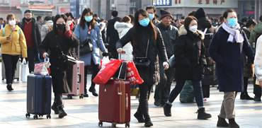 תושבי סין עם מסיכות פנים / צילום: Koki Kataoka, רויטרס