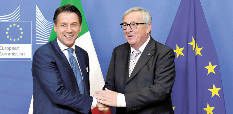 נשיא הנציבות האירופית וראש ממשלת איטליה/ צילום: רויטרס  Piroschka Van De Wouw 