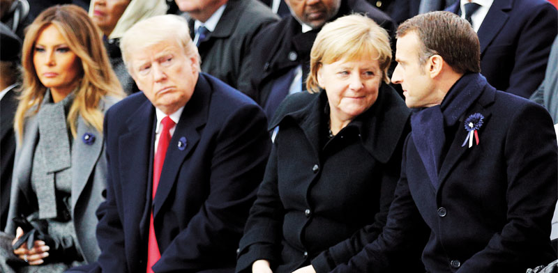 הנשיא טראמפ עם הקנצלרית מרקל והנשיא מאקרון/  צילום: רויטרס POOL New