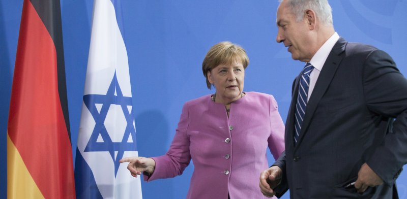 Angela Merkel and Benjamin Netanyahu Photo: ASAP Creative Shutterstock