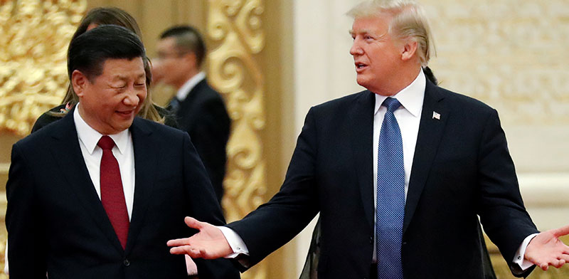 נשיא ארה"ב טראמפ ומקבילו הסיני שי ג'ינפינג. / צילום:  רויטרס / JONATHAN ERNST