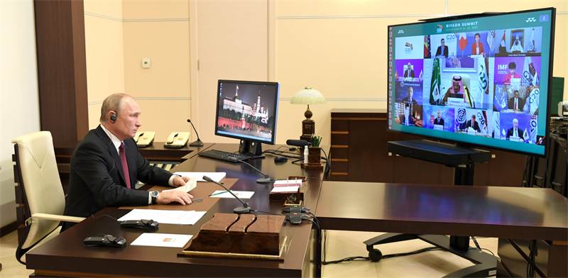 נשיא רוסיה ולדימיר פוטין משתתף בוועידת G20 בשיחת וידאו / צילום: Alexei Nikolsky/Russian Presidential Press and Inf, רויטרס